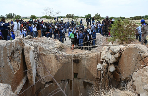 South Africa’s police minister has pledged to rescue all  people still trapped in abandoned goldmine