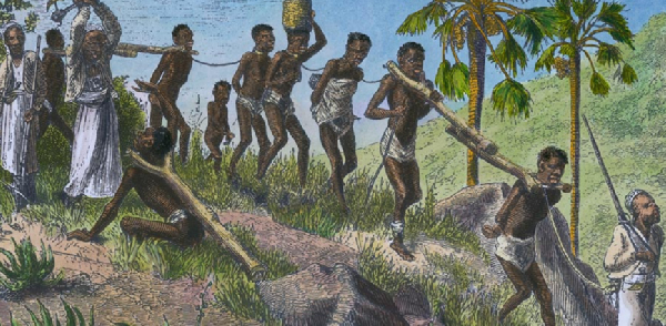 A picture of slaves being chained