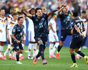 Paraguay players celebrate after winning the penalty shootout