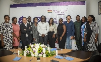 Stonebwoy and Dr. Louisa in a group photo with Ghandour Cosmetics staff
