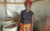 Lucy Everlyn Atim in her store were she keeps harvested shea nuts