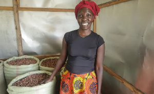 Lucy Everlyn Atim in her store were she keeps harvested shea nuts