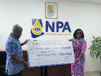 Godwin Kudzo Tameklo making a presentaion to Adwoa Oboubia Opku-Darko