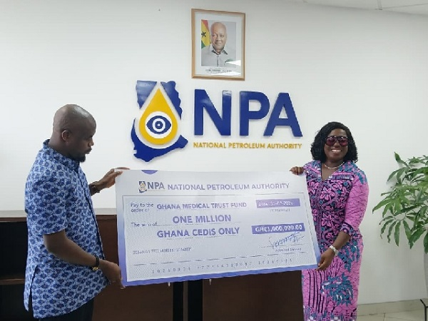 Godwin Kudzo Tameklo making a presentaion to Adwoa Oboubia Opku-Darko