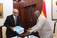 AKufo-Addo receiving the Commission's report