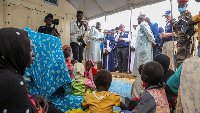 The WHO's Tedros Ghebreyesus (centre in background) also visited a camp for Sudanese refugees