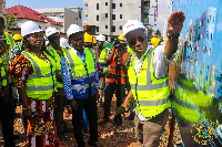 Akandoh and other personnel inspecting the La General Hospital project