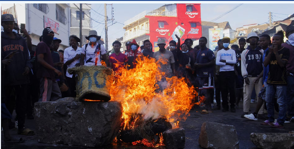 Protesters barricade a road with burning tyres during a nationwide youth-led demonstration
