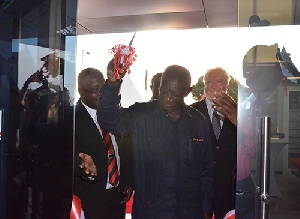 Ex-President Kufuor cutting the tape of the new bank