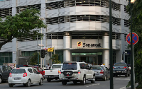 Cars are seen infront of the head office of Angola's state oil company Sonangol on June 7, 2016