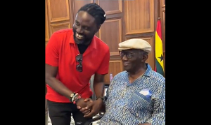 Roman Fada and Former President John Agyekum Kufuor exchanging handshake