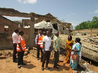 Mrs. Della Sowah visiting the site of the collapsed building