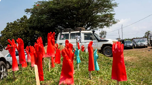 Rubber gloves are laid out on the ground outside the Rwampara General Hospital Rubber gloves are laid out on the ground outside the Rwampara General Hospital