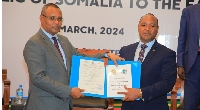 Somalia’s Minister of Commerce and Industry (L) and EAC Secretary-General Peter Mathuki