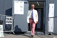 Britain's Reform UK party leader Nigel Farage leaves a polling station