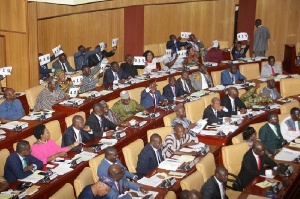 Members of NDC Minority MPs' displaying placards after the budget hearing