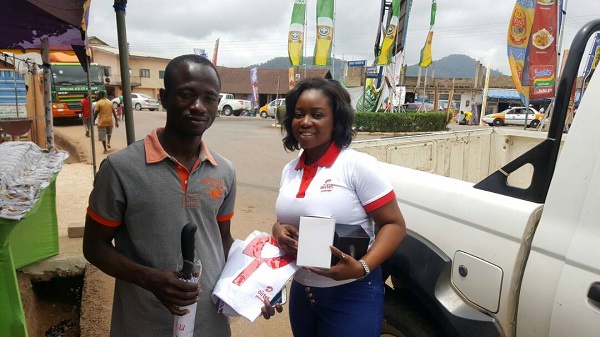 Airtel Premier customer (L) with his souvenirs