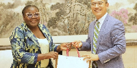 Dr. Winnifred Nafisa Mahama in a picture with a representative from the China Media Group