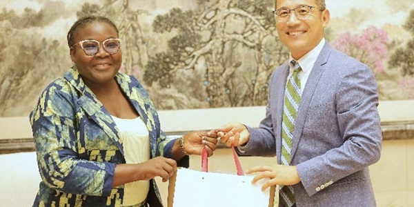 Dr. Winnifred Nafisa Mahama in a picture with a representative from the China Media Group