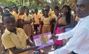 Raphael Patrick Sarfo donating textbooks to the school