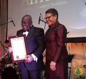 President Akufo-Addo being presented with a Congressional Record by US Congresswoman Karen Ruth Bass