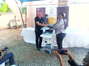 Dr Esther Odame-Asiedu receiving the items