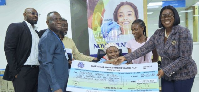 Oboubia Darko-Opoku presenting the checque for Rebecca's treatment