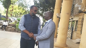 Rwandan investor Desire Muhinyuza (left) with his lawyer Danstan Omari