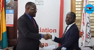 Humphrey Ayim-Darke (L)  giving CEO of Appolonia City, Bright Owusu-Amofah (R) a handshake