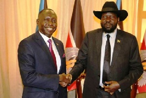 Ambassador Simon Michael Duku (left) and South Sudanese President Salva Kiir (right) in hand shake