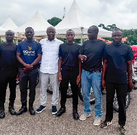 Some of the beneficiaries with Mahama in a photograph