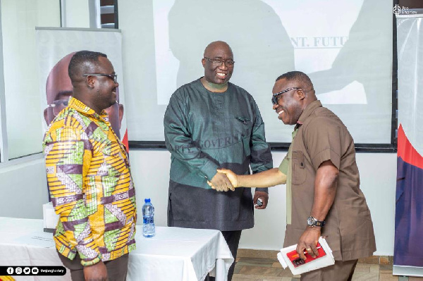 Joe Ghatey shaking the hands of some of the executives after the meeting