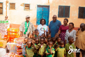 Prof. Opoku-Agyemang in a picture with some NDC members and children at the Nyohini Children's Home