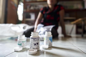 Woman Displays HIV Antiretroviral Drugs To Journalist In Interview