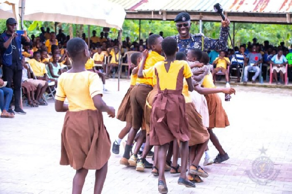 The IGP engaging in a fun time with the school children