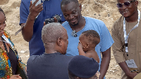 President Mahama carries child and reassures him as a proud African, not a slave