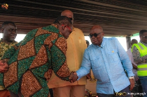 Sam George greets President Akufo-Addo at the project commissioning venue