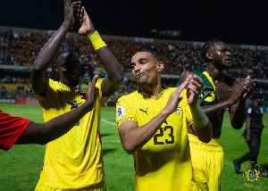 Ghana defender Alexander Djiku (M) celebrating his goal