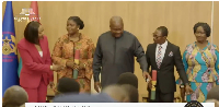 President John Dramani Mahama (M) redirecting Jane Mensah (L)