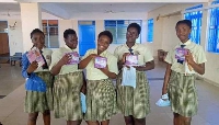 File Photo: Some students pose with a menstrual pad