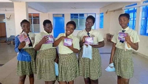 File Photo: Some students pose with a menstrual pad