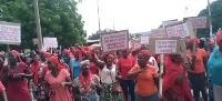 Some of the Ho market women holding placards