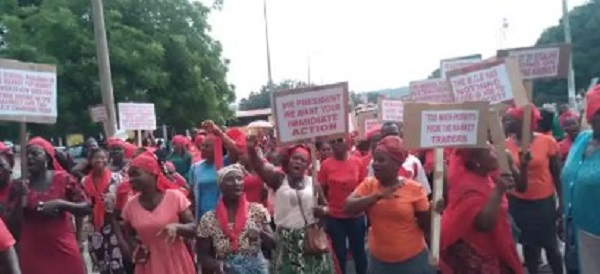 Some of the Ho market women holding placards