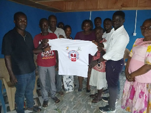 Executives captured in a photo with some members of the Yareyeya community