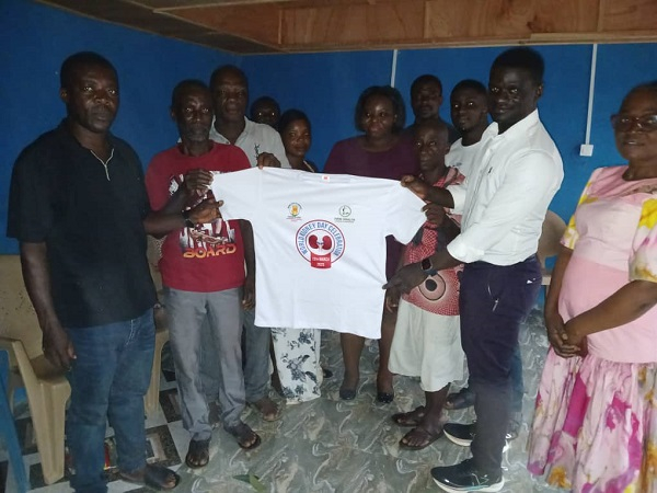 Executives captured in a photo with some members of the Yareyeya community