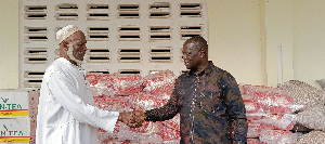 Emmanuel Armah-Kofi Buah on the right shaking hands with the Kangbumli Chief
