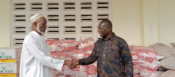 Emmanuel Armah-Kofi Buah on the right shaking hands with the Kangbumli Chief