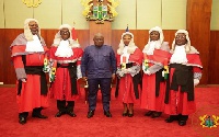 Nana Addo Dankwa Akufo-Addo, President of Ghana (M) posing for a photograph with the new judges