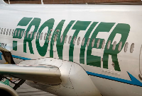 A Frontier Airlines airplane is parked at a gate at San Diego International Airport on May 27