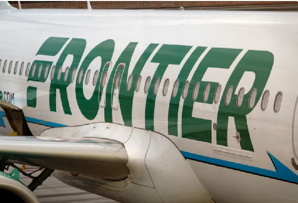A Frontier Airlines airplane is parked at a gate at San Diego International Airport on May 27